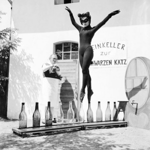 I knew that out there SOMEWHERE there were cool things, like, oh, maybe, shapely masked cat women dancing balanced on bottles.