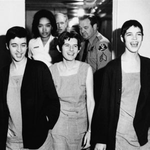 The Manson girls laugh as they enter the courtroom.
