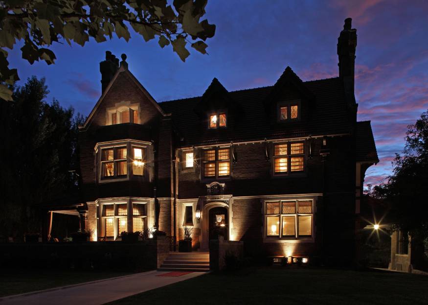 The 1904 Brandeis Mansion in Omaha's twilight. One of the mansion's owners, Mark Mazer, 